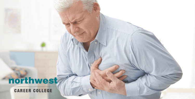 senior citizen clutching at his chest because he is having cardiac arrest