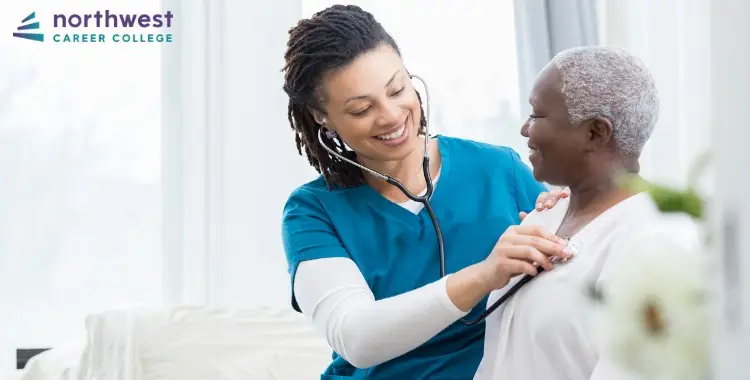 A healthcare worker checks a patients heartbeat, highlighting Medical Assisting In a Pandemic at Northwest Career College.