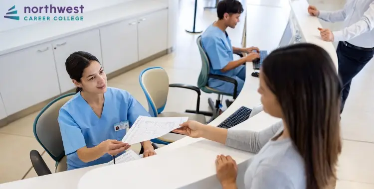 A medical administrative assistant hands paperwork to a patient, highlighting challenges faced by medical administrative.