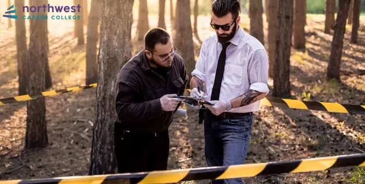 Two professionals examine evidence at a crime scene, highlighting why a career in criminal justice is more than just law.