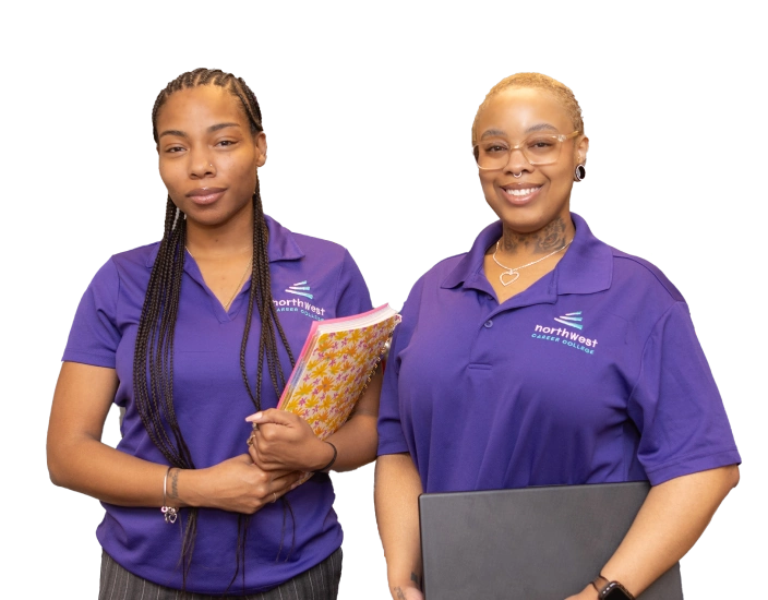 Two women in purple polo shirts, smiling and holding notebooks, representing business administrative assistant roles.