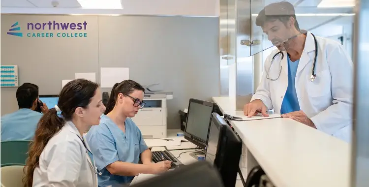 Medical professionals collaborate at a desk, highlighting Career Growth Opportunities in Medical Administrative Assistance.