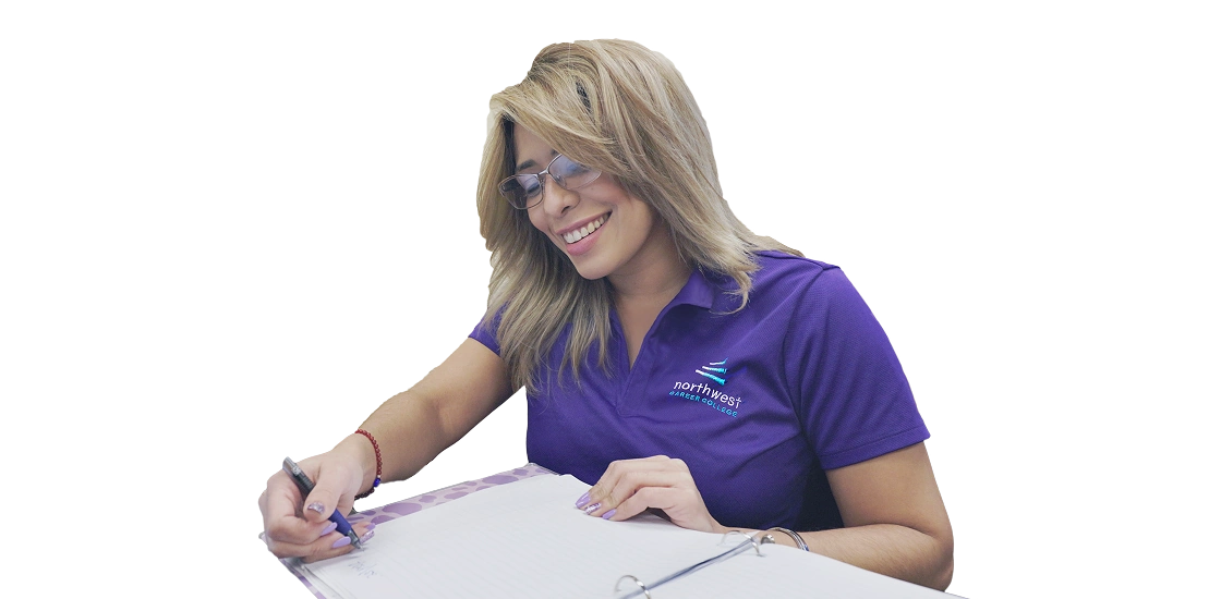 A student in a purple shirt smiles while taking notes, representing a positive atmosphere at paralegal school.