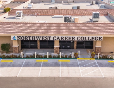 Exterior view of Northwest Career College, a trade school in East Las Vegas, featuring a parking lot and signage.