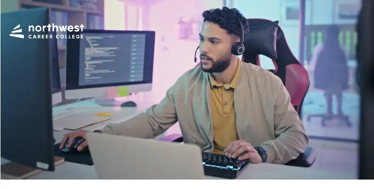 A man in a headset works at a computer, illustrating Best Communication Practices for IT Tech Remote Support.