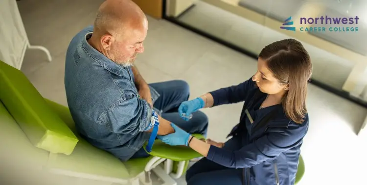 A nurse prepares to draw blood from a seated male patient in a clinical setting.