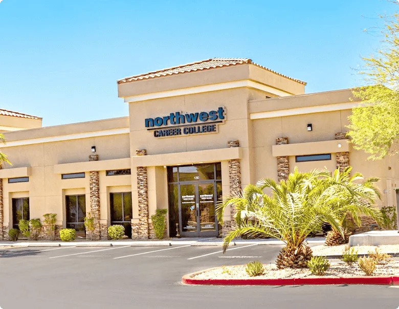 Exterior of Northwest Career College building with palm trees and clear blue sky.